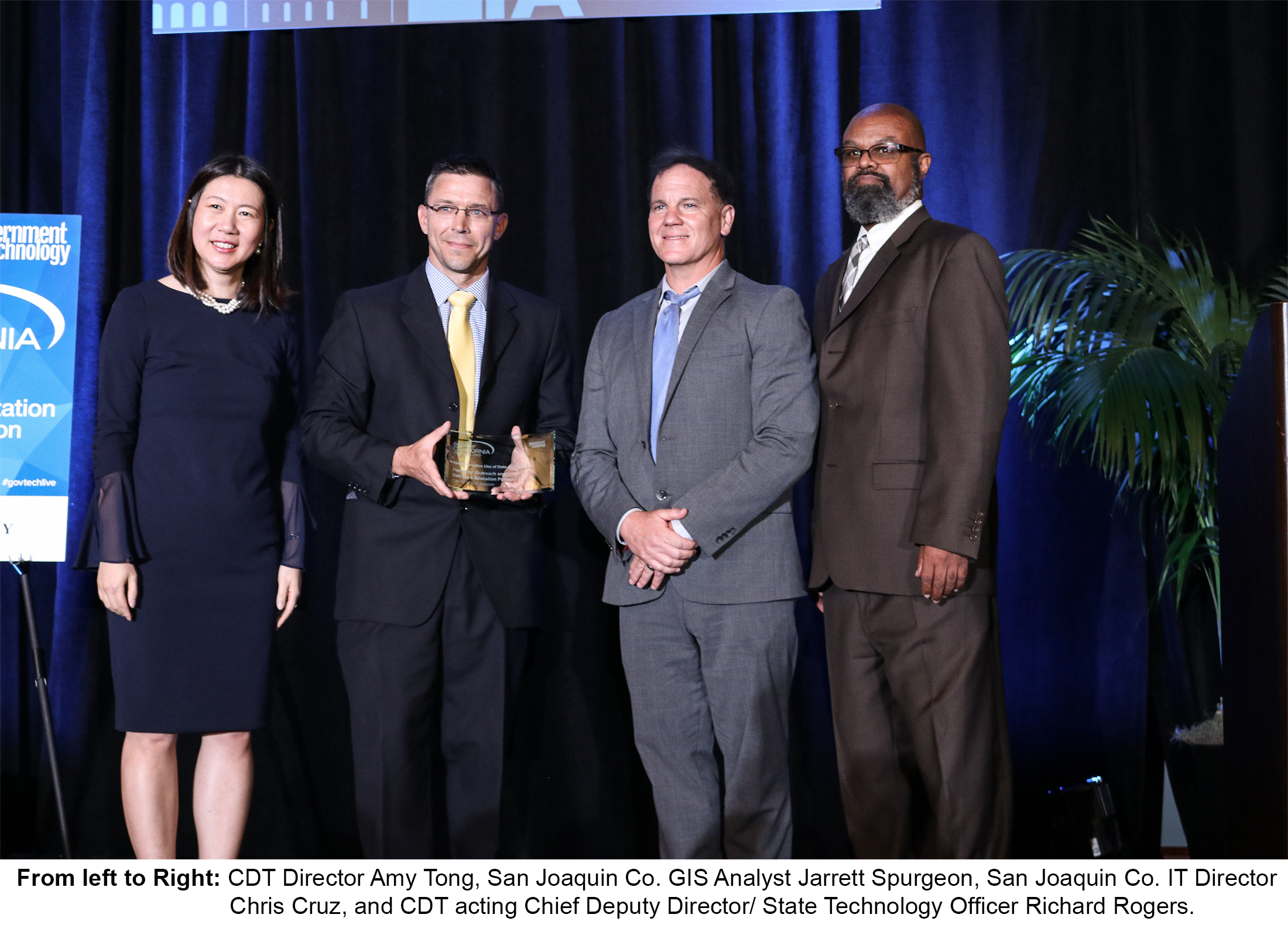 San Joaquin County GIS Analyst Jarrett Spurgeon and IT Director Chris Cruz receiving CA CIO Academy Award from CDT Director Amy Tong and CDT Acting Chief Deputy Director and State Technology Officer Richard Rogers 